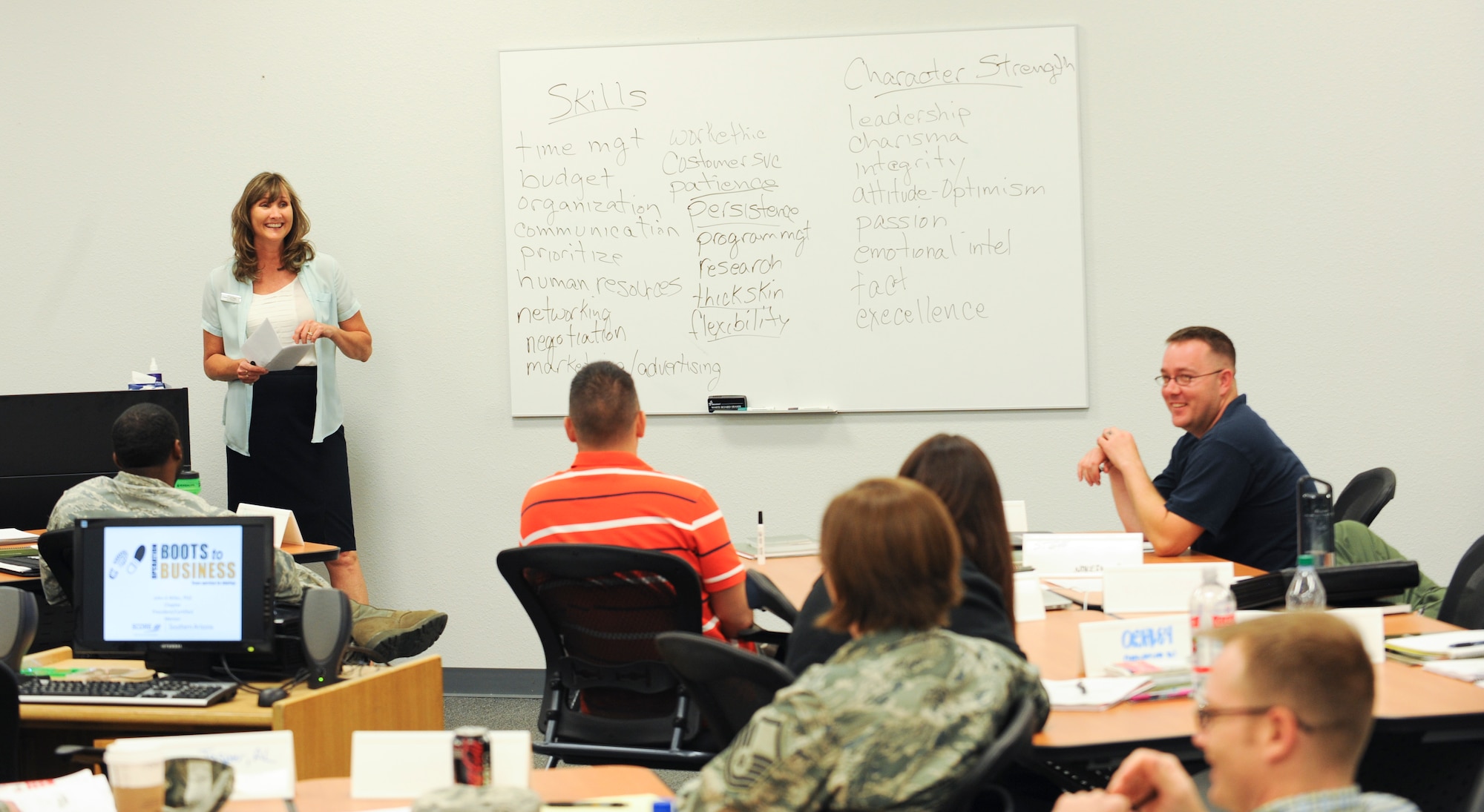 Joy Hopper, 355th Force Support Squadron community readiness consultant, speaks to service members and Department of Defense civilian employees during a transition assistance program seminar at Davis-Monthan Air Force Base, Ariz., May 21, 2014. TAP was established to meet the needs of separating service members during their period of transition into civilian life by offering job search assistance and related services. (U.S. Air Force photo by Senior Airman Sivan Veazie/Released)