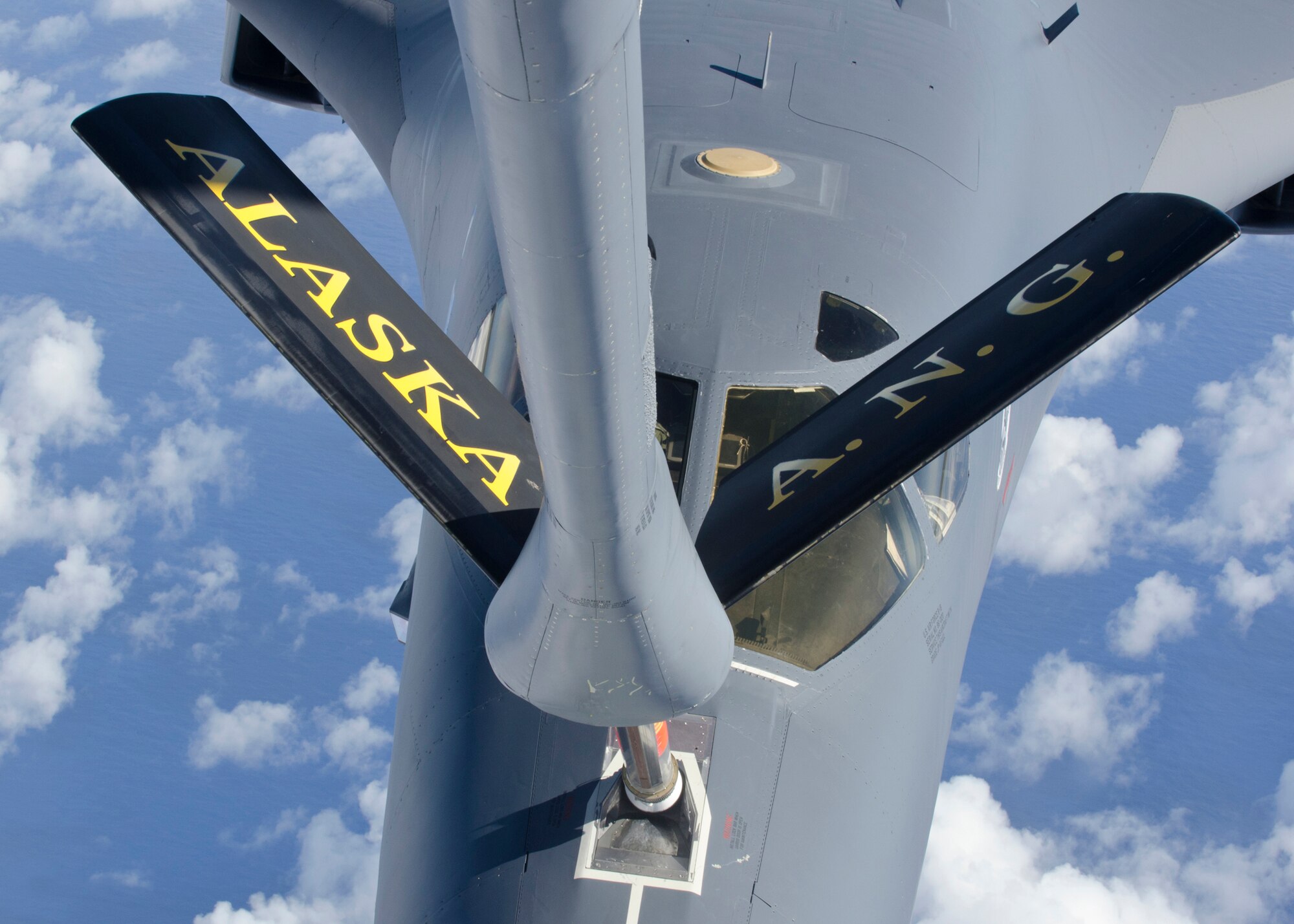 A B-1B Lancer from the 34th Bomb Squadron, Ellsworth Air Force Base, S.D., receives fuel from a KC-135 Stratotanker from the 168th Air Refueling Wing, Alaska Air National Guard, Eielson Air Force Base, Alaska, over the Pacific Ocean May 14, 2014. The flight was in support of a mission in which two B-1 bombers from Ellsworth flew round trip, non-stop to training ranges near Guam, demonstrating the nation’s capability to provide a flexible and always ready force to respond to a variety of threats and situations.  (U.S. Air Force photo by Senior Airman Katrina M. Brisbin/Released)