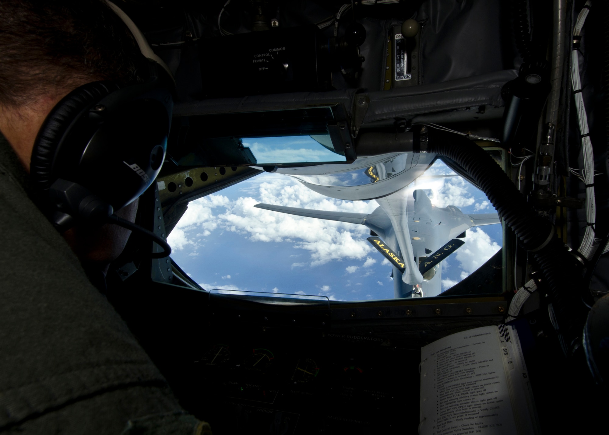 Master Sgt. Dale Ryan, 166th Air Refueling Squadron boom operator, refuels a B-1B Lancer from the 34th Bomb Squadron, Ellsworth Air Force Base, S.D., over the Pacific Ocean May 14, 2014. Flying in support of a Global Power Mission, two B-1 bombers flew more than 30 hours round trip, employing inert munitions on a training range near Guam before returning home.  (U.S. Air Force photo by Senior Airman Katrina M. Brisbin/Released)