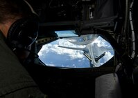 Master Sgt. Dale Ryan, 166th Air Refueling Squadron boom operator, refuels a B-1B Lancer from the 34th Bomb Squadron, Ellsworth Air Force Base, S.D., over the Pacific Ocean May 14, 2014. Flying in support of a Global Power Mission, two B-1 bombers flew more than 30 hours round trip, employing inert munitions on a training range near Guam before returning home.  (U.S. Air Force photo by Senior Airman Katrina M. Brisbin/Released)