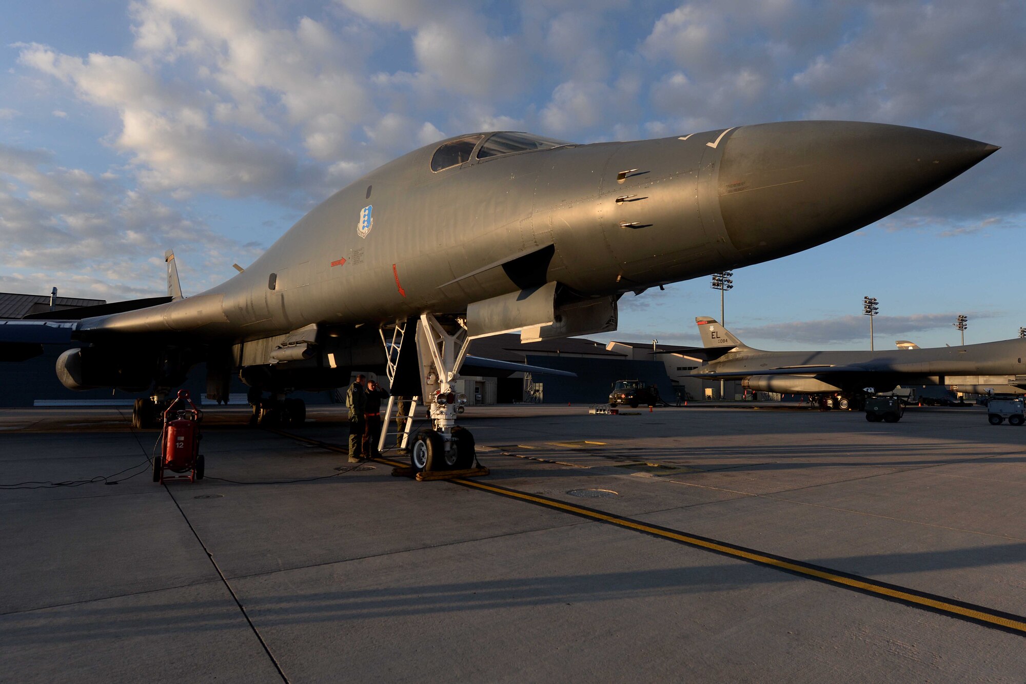 Aviators and maintainers perform final checks on a B-1B Lancer, May 12, 2014 on the flightline at Ellsworth Air Force Base, S.D. The 28th Bomb Wing generated two B-1s in support of a round trip, non-stop training mission from Ellsworth to employ munitions on a range near Guam, demonstrating the long-range, precision strike capabilities of the aircraft. (U.S. Air Force photo by Airman 1st Class Rebecca Imwalle/Released) 