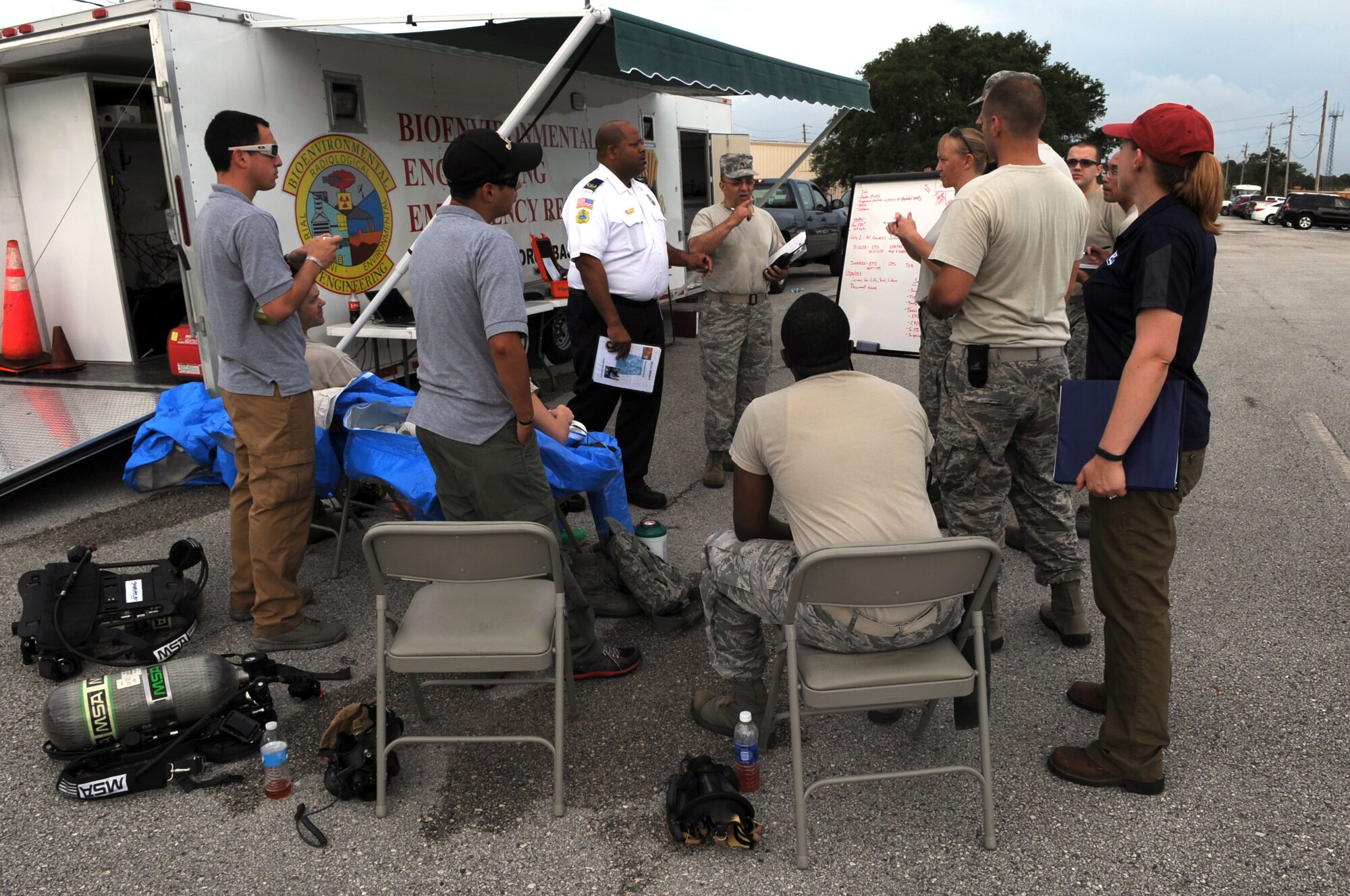Members from the 6th Aerospace Medicine Squadron receive a safety briefing at MacDill Air Force Base, Fla., May 15, 2014. The bioenvironmental engineer flight participated in a week-long integrated base emergency response training with simulated situations. (U.S. Air Force photo by Airman 1st Class Tori Schultz/Released)