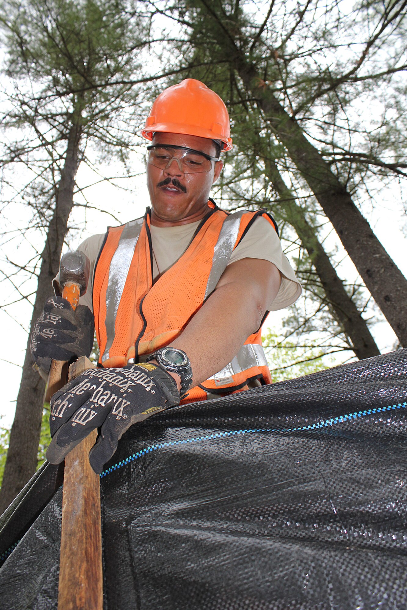 140521-Z-VA676-059 -- Senior Airman Jason Armstrong pounds in a stake while constructing an erosion control fence at Camp Hinds Boy Scout Camp, Raymond, Maine, May 21, 2014. The Airmen are members of the 127th Civil Engineer Squadron, based at Selfridge Air National Guard Base, Mich. The Airmen, along with Marine Corps Reservists and Army Reservists, are working on various construction projects at the camp during an Innovative Readiness Training mission, which allows military personnel to get training in various tasks and a community organization, in this case the Boy Scouts, to benefit from the work. (U.S. Air National Guard photo by Technical Sgt. Dan Heaton)