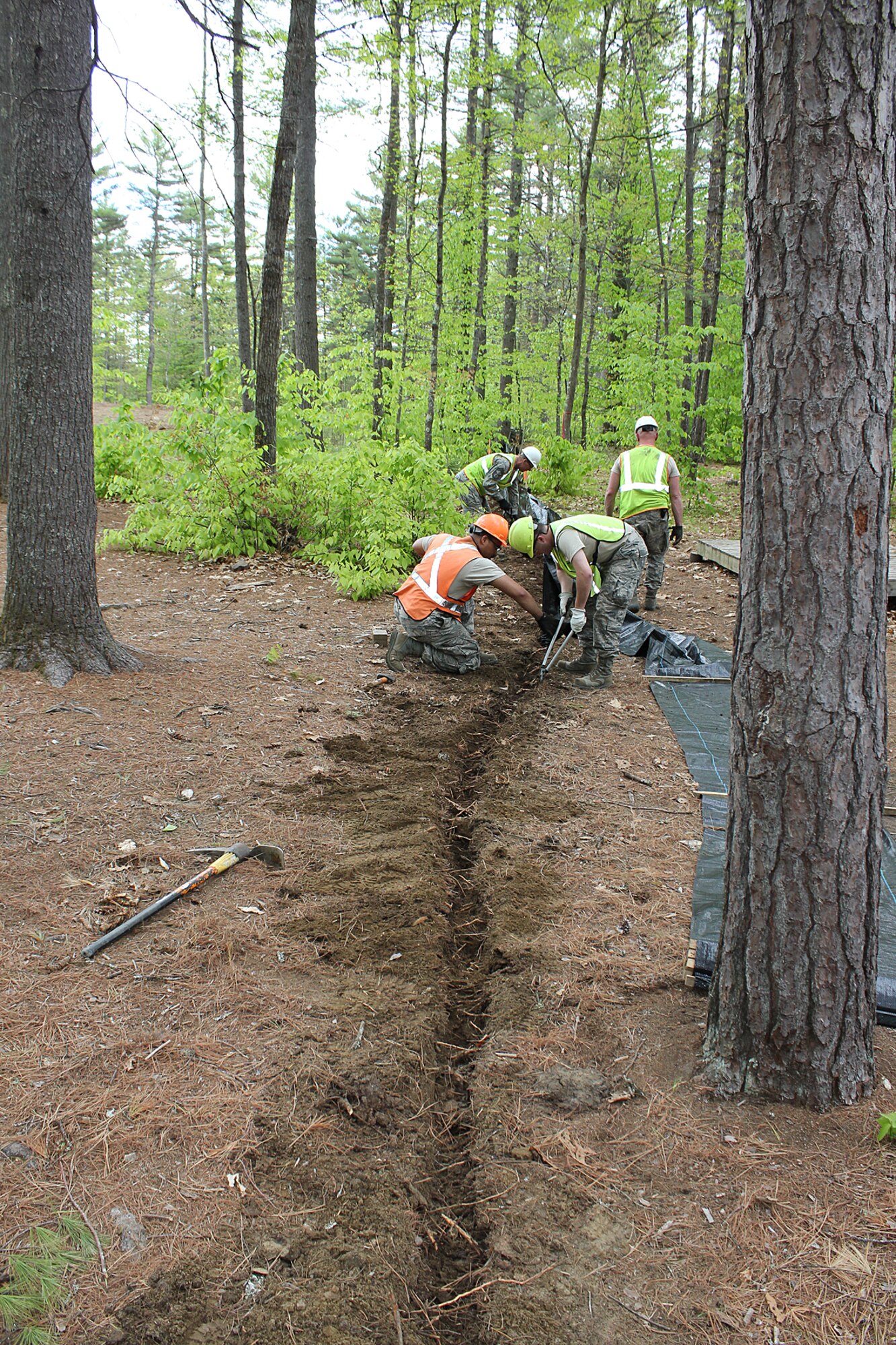 140521-Z-VA676-053 -- Michigan Air National Guard Airmen construct an erosion control fence at Camp Hinds Boy Scout Camp, Raymond, Maine, May 21, 2014. The Airmen are members of the 127th Civil Engineer Squadron, based at Selfridge Air National Guard Base, Mich. The Airmen, along with Marine Corps Reservists and Army Reservists, are working on various construction projects at the camp during an Innovative Readiness Training mission, which allows military personnel to get training in various tasks and a community organization, in this case the Boy Scouts, to benefit from the work. (U.S. Air National Guard photo by Technical Sgt. Dan Heaton)