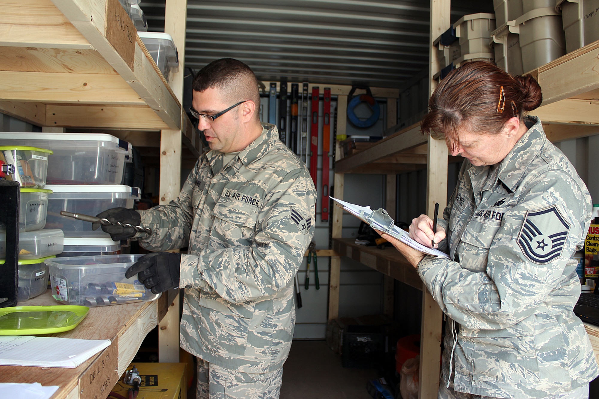 140521-Z-VA676-038 -- Senior Airman Jason Navarre and Master Sgt. Maria Russell conduct an inventory check of tools and equipment at Camp Hinds Boy Scout Camp, Raymond, Maine, May 21, 2014. Navarre and Russell are members of the 127th Civil Engineer Squadron, based at Selfridge Air National Guard Base, Mich. The Airmen, along with Marine Corps Reservists and Army Reservists, are working on various construction projects at the camp during an Innovative Readiness Training mission, which allows military personnel to get training in various tasks and a community organization, in this case the Boy Scouts, to benefit from the work. (U.S. Air National Guard photo by Technical Sgt. Dan Heaton)