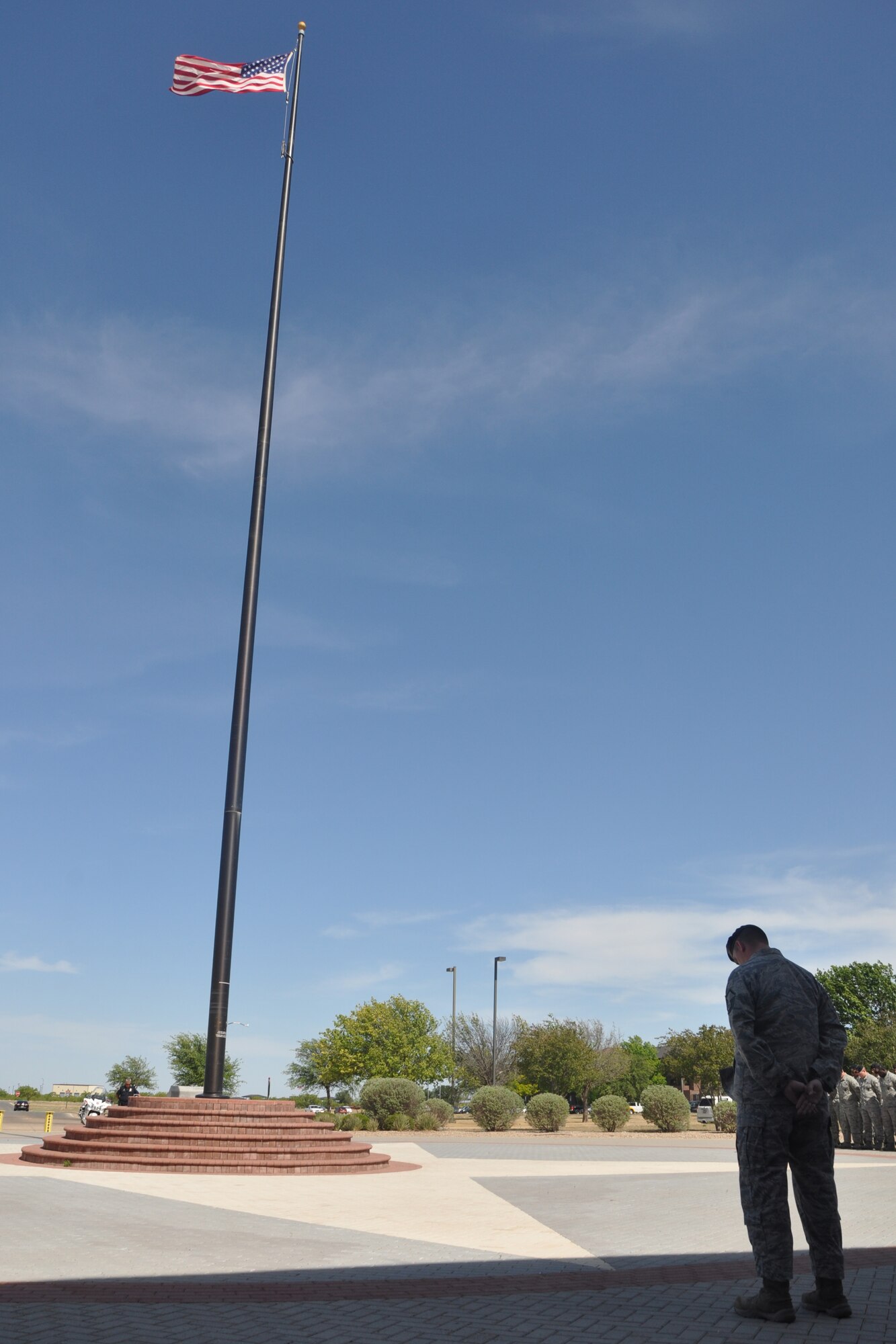GOODFELLOW AIR FORCE BASE, Texas – Master Sgt. James D. Eselgroth, 17th Security Forces Logistics and Resources superintendent, bows his head in prayer during the Retreat Ceremony at the Norma Brown Building here May 16.  The 17th SFS invited Goodfellow to take part in various events to help commemorate those lost in the line of duty and celebrate the commitment of law enforcement officers everywhere, during Police Week. (U.S. Air Force photo/ Airman 1st Class Breonna Veal) 