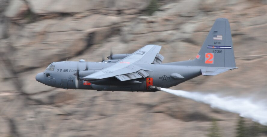 An Air Force Reserve Command C-130H assigned to the 302nd Airlift Wing drops a load of water during Modular Airborne Fire Fighting System certification near Hackett Mountain in Colorado May 18, 2014. (U.S. Air Force photo/Master Sgt. Daniel Butterfield)