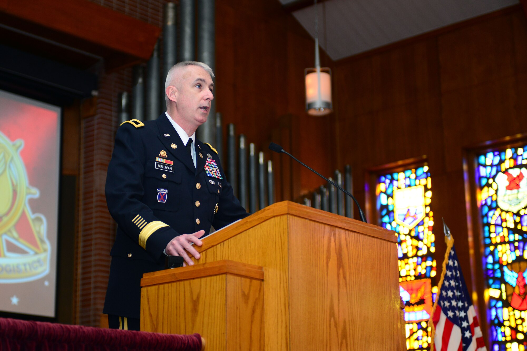U.S. Army Brig. Gen. John P. Sullivan, Army chief of transportation, speaks to family members and Soldiers during the Transportation Corps Memorial Wall Rededication Ceremony at Fort Eustis, Va., May 21, 2014.  Although the Transportation Corps headquarters is now at Fort Lee, because of a strong tie to Fort Eustis, Sullivan said it was only fitting to hold the rededication ceremony at Fort Eustis, which is the home to many of the Army’s watercraft fleet, the 7th Transportation Brigade Expeditionary, the 597th Transportation Brigade and the Transportation Museum, and also where thousands of transportation Soldiers are trained each year. (U.S. Air Force photo by Staff Sgt. Katie Gar Ward/Released) 