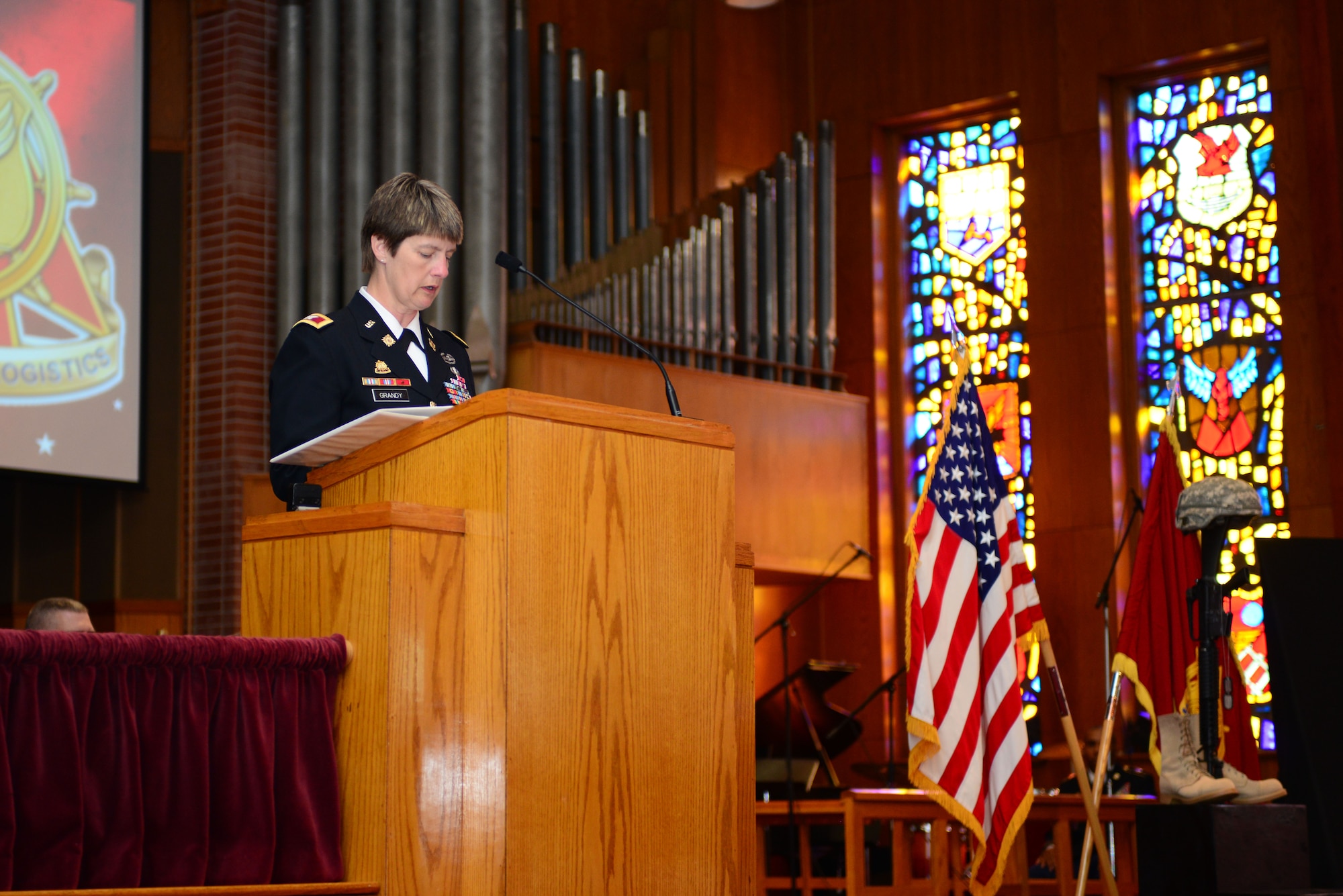 U.S. Army Col. Nancy Grandy, Army Transportation School assistant commandant, gives opening remarks during the Transportation Corps Memorial Wall Rededication Ceremony at Fort Eustis, Va., May 21, 2014.  The Memorial Wall is located in the Transportation Corps Regimental Chapel at Fort Eustis, and is inscribed with 1,972 names of Army transporters who gave their lives in the defense of freedom in conflicts ranging from the Vietnam War to Operations Iraqi and Enduring Freedom. (U.S. Air Force photo by Staff Sgt. Katie Gar Ward/Released)