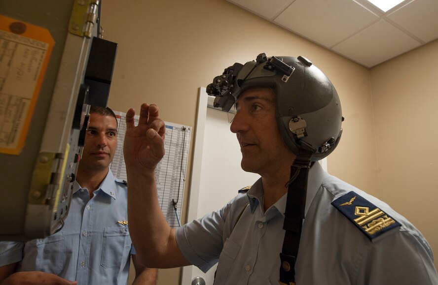 Italian air force Maj. Antonio Massara shows Italian air force Maj. Gen. Nicola Lanza de Cristoforis, Combat Forces Command commander, a simulated joint terminal attack controller (JTAC) module at Moody Air Force Base, Ga., May 21, 2014. JTACs use modules to help direct airstrikes to pilots for close air support. (U.S. Air Force photo by Airman Dillian Bamman/Released)