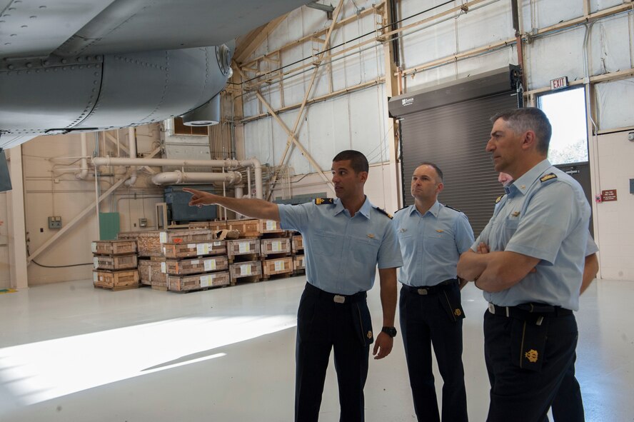 Italian air force Maj. Antonio Massara, 74th Fighter Squadron exchange pilot, gives Italian air force Maj. Gen. Nicola Lanza de Cristoforis, Combat Forces Command commander, and other Italian air force officers a rundown of the A-10C Thunderbolt II aircraft at Moody Air Force Base, Ga., May 21, 2014. Massara is one of two exchange pilots with the 23d Fighter Group. (U.S. Air Force photo by Airman Dillian Bamman/Released)