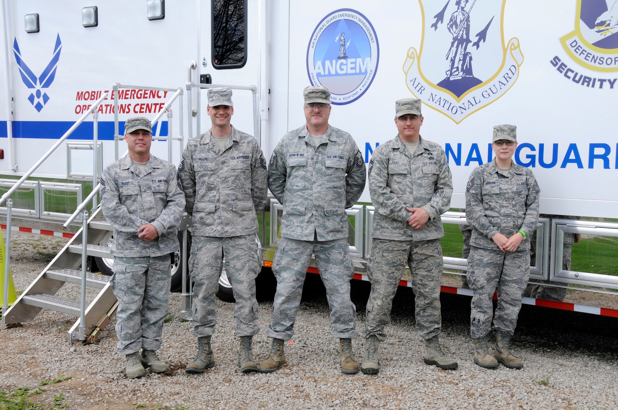 Emergency Management and Communications personnel from the 182nd Airlift Wing pose with their Mobile Emergency Operations Center (MEOC) vehicle following the conclusion of SIMCOM 2014 at Sunnyview Expo Center in Oshkosh, Wis. May 15, 2014. SIMCOM (State Interoperable Mobile Communications) is a functional exercise designed to test the interoperability of federal, state, county, tribal, volunteer, private organizations and defense communications and data sharing. Air National Guard photo by Tech. Sgt. Todd Pendleton (Released)