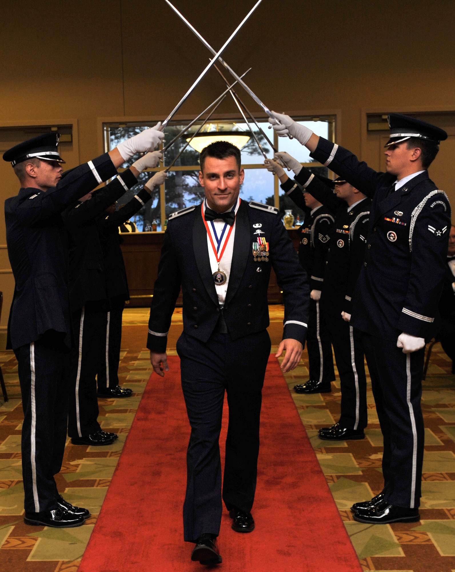 Capt. Ben Self, 321st Special Tactics Squadron, RAF Mildenhall, England, walks down the red carpet at the Soundside Club on Hurlburt Field, Fla., May 15, 2014. Self received the Air Force Special Operations Command Company Grade Officer of the Year award. (U.S. Air Force photo/Senior Airman Kentavist P. Brackin)