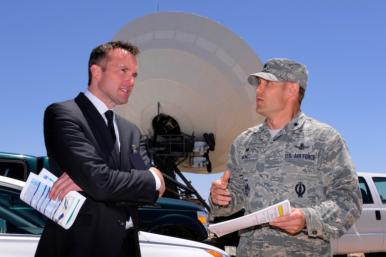 Undersecretary of the Air Force Eric Fanning tours the 4th Space Operations Squadron mobile unit with Lt. Col. Monte Munoz, 4 SOPS commander, May 19, 2014, at Schriever Air Force Base, Colo. Fanning visited Schriever to learn about protected satellite communication and the role of the mobile mission. He also visited the Missile Defense Integration and Operations Center as well as the Joint Functional Component Command for Integrated Missile Defense operations. (U.S. Air Force photo/Christopher DeWitt)