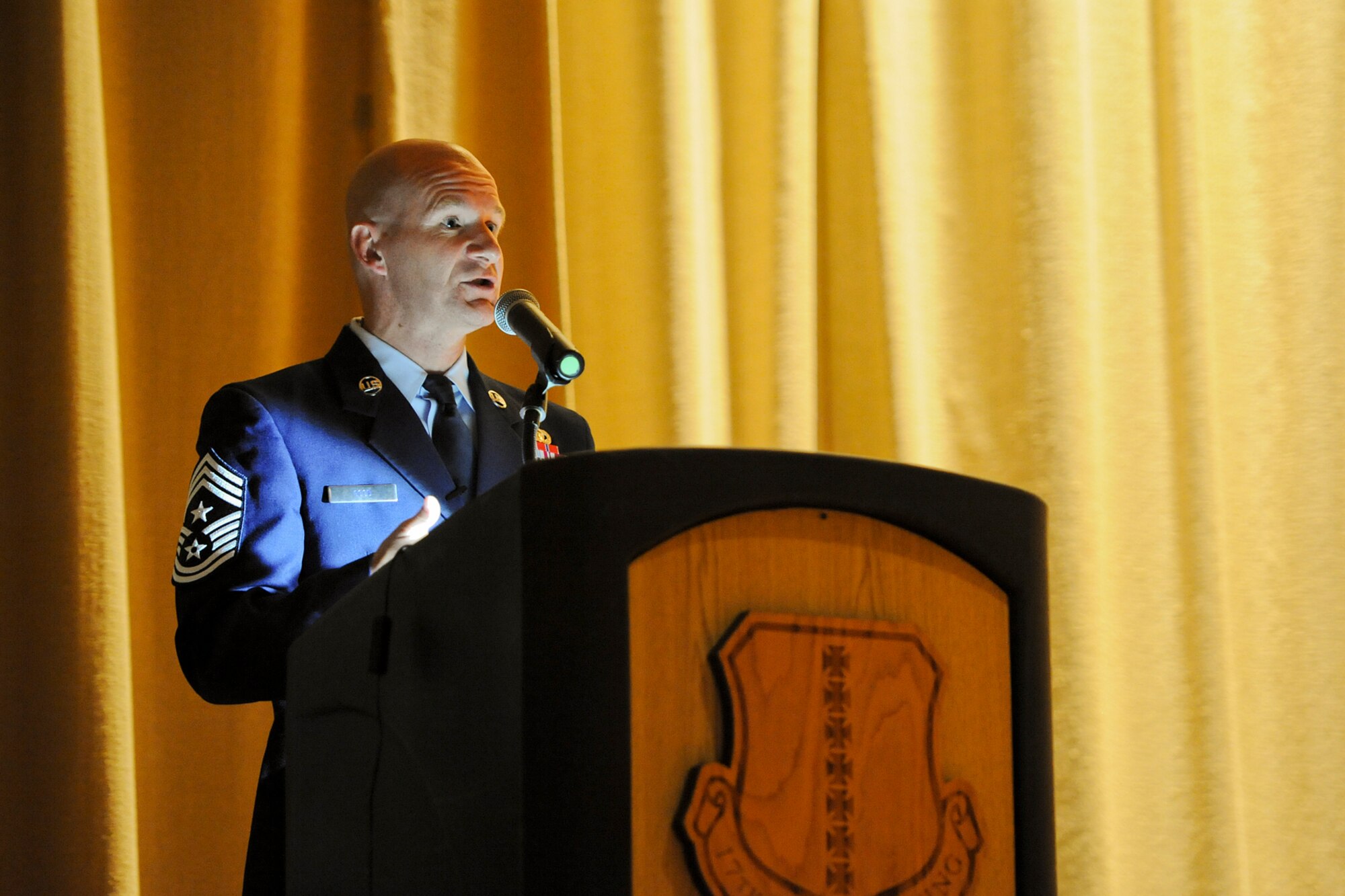 GOODFELLOW AIR FORCE BASE, Texas – Chief Master Sgt. Thomas F. Good, 17th Training Wing Command Chief, gives a speech during the Community College of the Air Force and Park University graduation at the base theater here May 16. Good talked about his past experiences and expressed the importance of getting an education. (U.S. Air Force photo/ Airman 1st Class Devin Boyer)