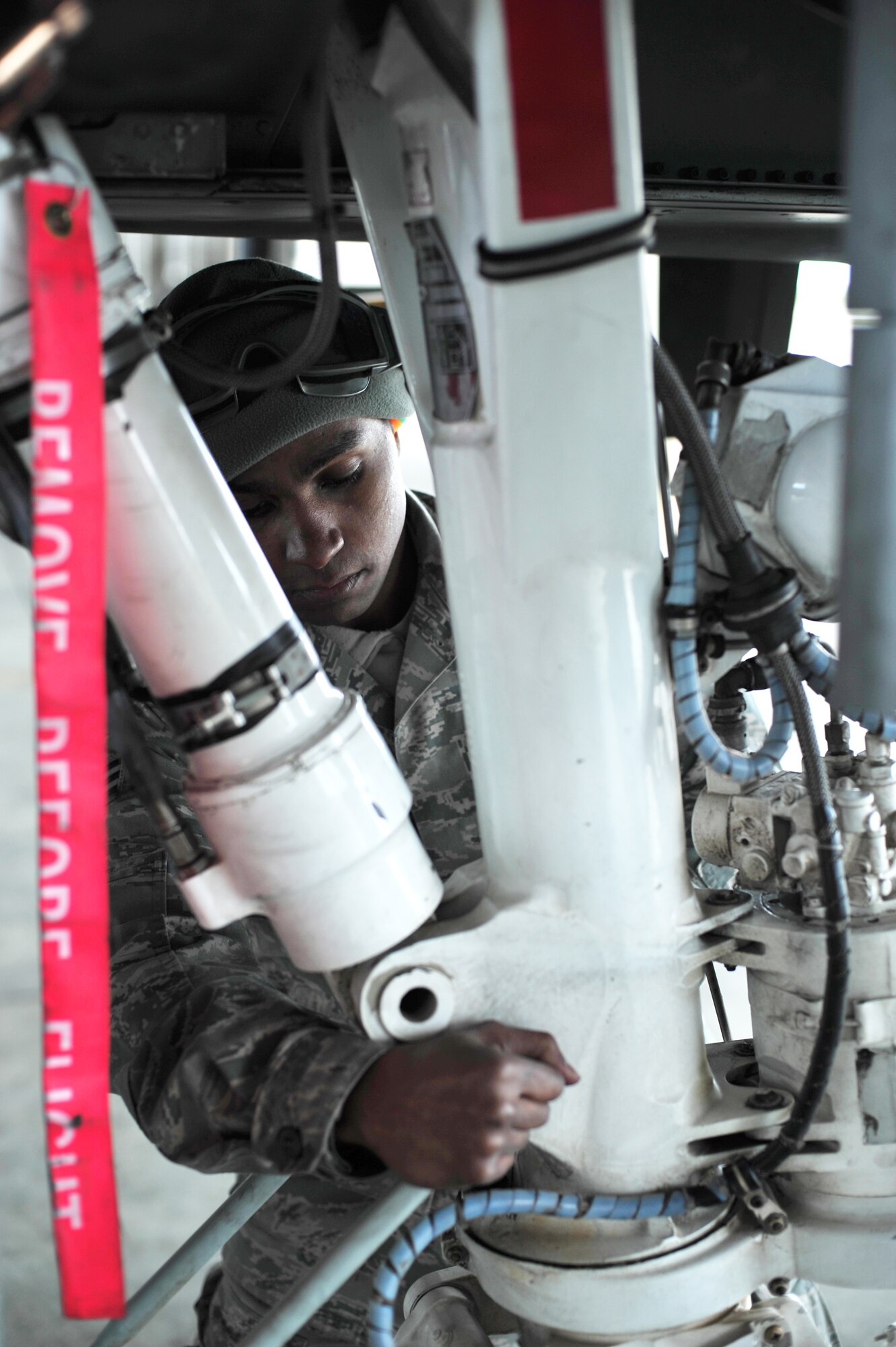 U.S. Air Force Senior Airman Bennie Hatch, 355th Aircraft Maintenance Squadron crew chief from Davis-Monthan Air Force Base, Ariz., performs preflight inspections on an A-10 Thunderbolt II during RED FLAG-Alaska 14-1 May 20, 2014, Eielson Air Force Base, Alaska. Hatch prepared A-10 Thunderbolt II’s to ensure the safety of pilots. (U.S. Air Force photo by Staff Sgt. Jim Araos)