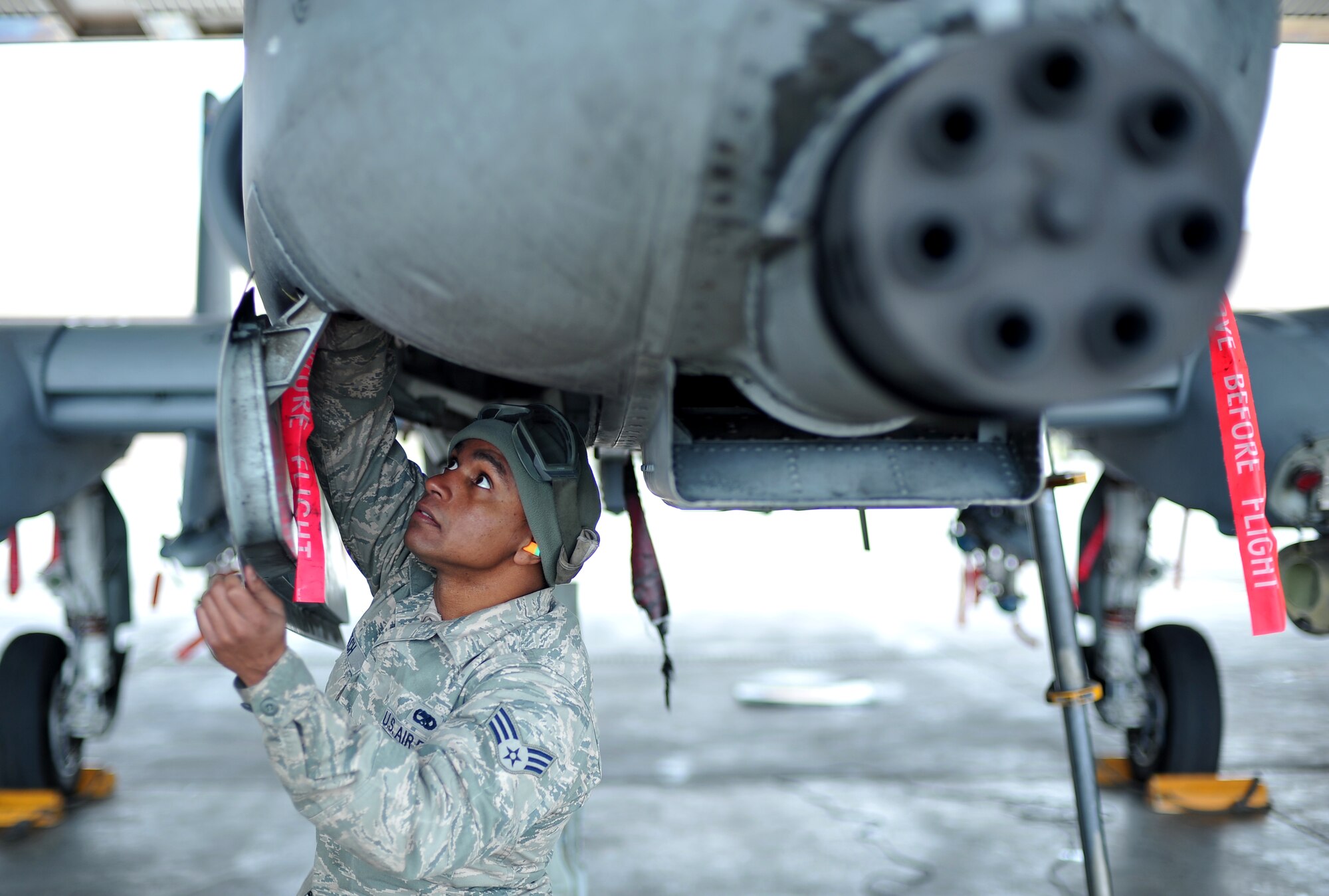 U.S. Air Force Senior Airman Bennie Hatch, 355th Aircraft Maintenance Squadron crew chief from Davis-Monthan Air Force Base, Ariz., performs a preflight inspection on an A-10 Thunderbolt II during RED FLAG-Alaska 14-1 May 20, 2014, Eielson Air Force Base, Alaska. When units deploy to RF-A, maintainers must perform all aircraft maintenance, being as self-sufficient at Eielson as they would be in a wartime environment. (U.S. Air Force photo by Staff Sgt. Jim Araos)