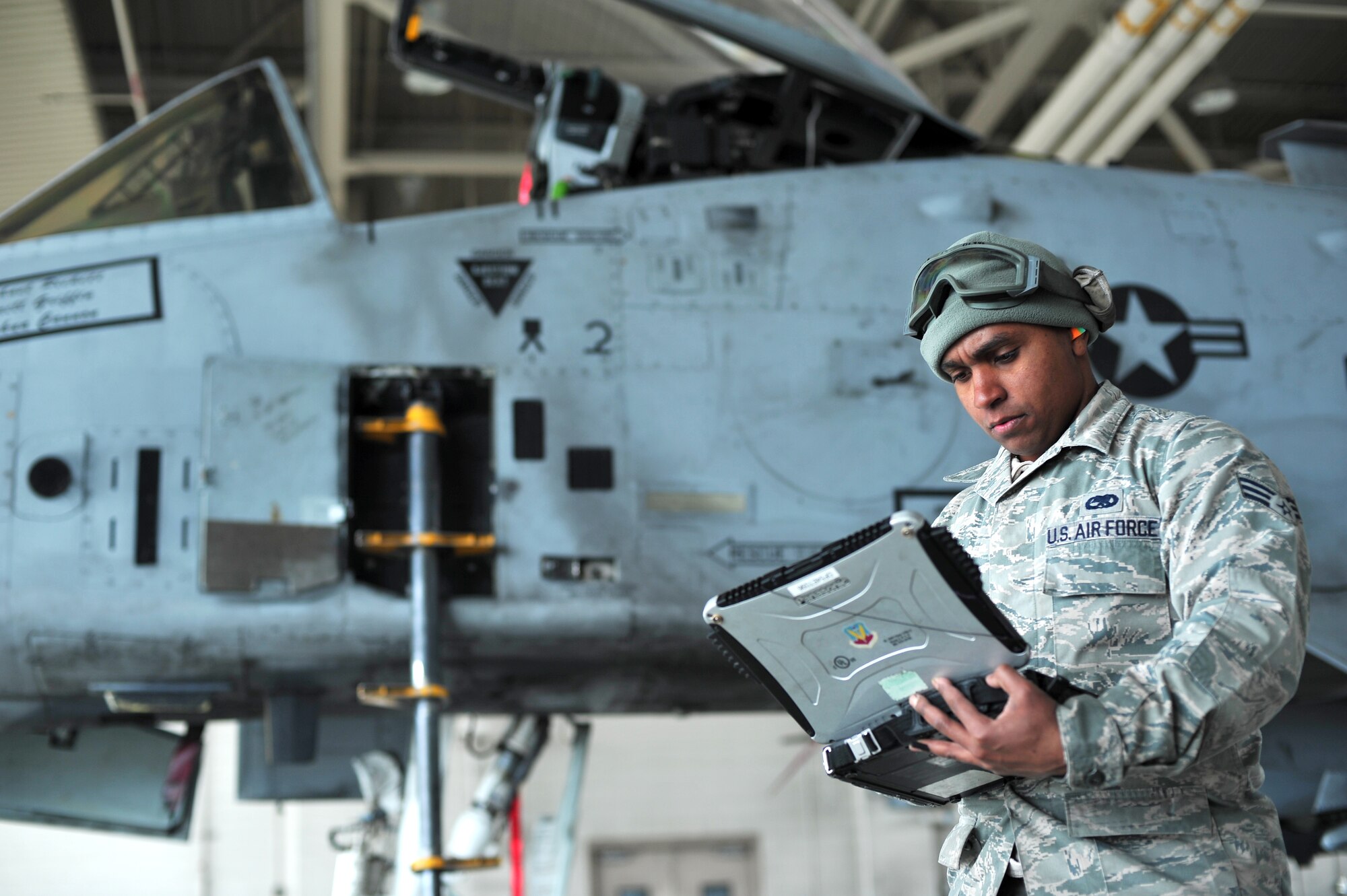 U.S. Air Force Senior Airman Bennie Hatch, 355th Aircraft Maintenance Squadron crew chief from Davis-Monthan Air Force Base, Ariz., looks through his technical orders during RED FLAG-Alaska 14-1 May 20, 2014, Eielson Air Force Base, Alaska.  Technical orders act as manuals for maintainers to follow when performing maintenance on aircraft. (U.S. Air Force photo by Staff Sgt. Jim Araos)