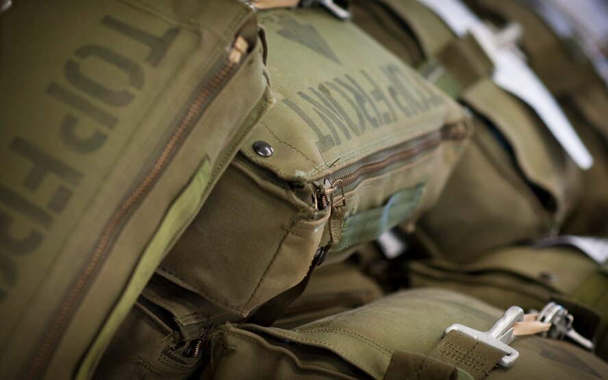Survival kits sit on a table at the aircrew flight equipment shop on Hurlburt Field, Fla., May 20, 2014. The kits contain various survial items for aircrew members. (U.S. Air Force photo/Senior Airman Krystal M. Garrett) 