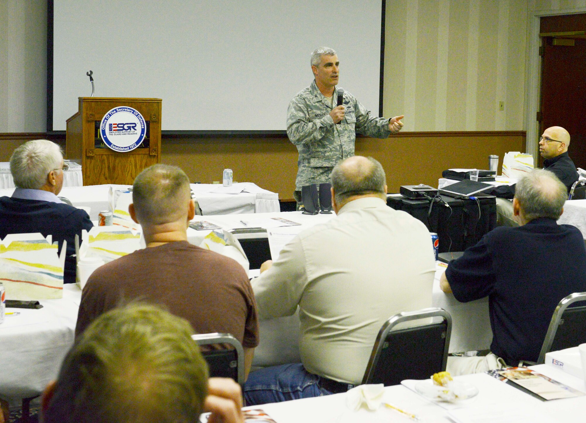 Col. Keith Wesley, 934th Operations Group commander, talks about the 934th Airlift Wing and Air Force Reserve mission to members of the Employer Support of the Guard and Reserve at their Minnesota conference May 19. The ESGR promotes cooperation and understanding between Reserve Component service members and their civilian employers. (Air Force Photo/Paul Zadach)