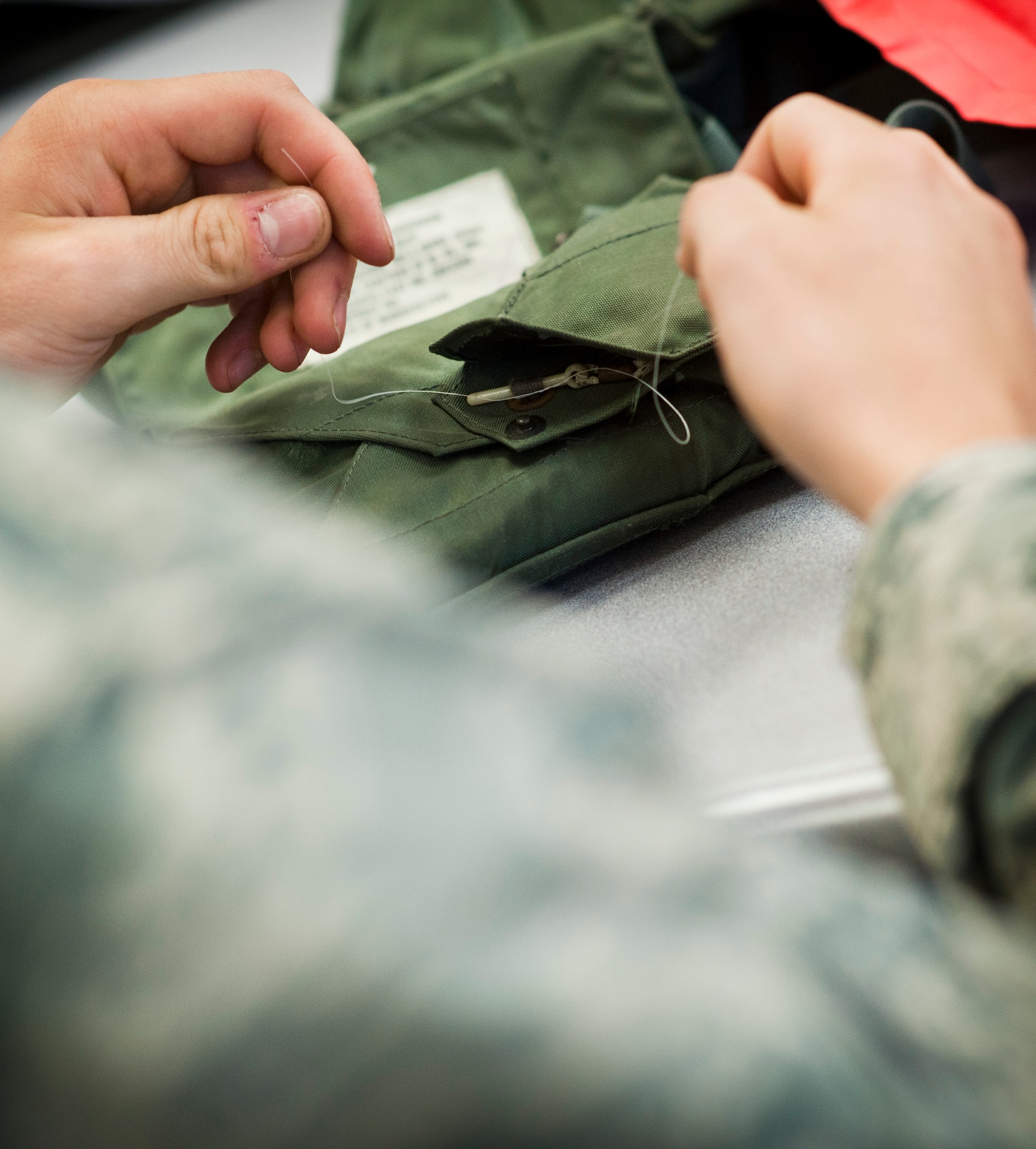 Airman 1st Class Tyler Holmes, 1st Special Operations Support Squadron aircrew flight equipment apprentice, inspects a life preserver unit at the AFE shop on Hurlburt Field, Fla., May 20, 2014. The 1st SOSS AFE shop inspects and packs about 100 LPUs a month. (U.S. Air Force photo/Senior Airman Krystal M. Garrett) 