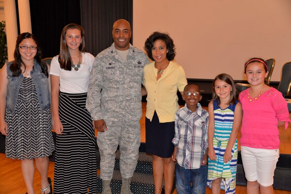 42nd Air Base Wing commander, Col. Trent Edwards and his wife Vanessa, share smiles with the children selected to read their essays about life as a military child, May 21, 2014, at the Spouse Appreciation Lunch, held at the Maxwell Club. (U.S. Air Force photo by Donovan Jackson)