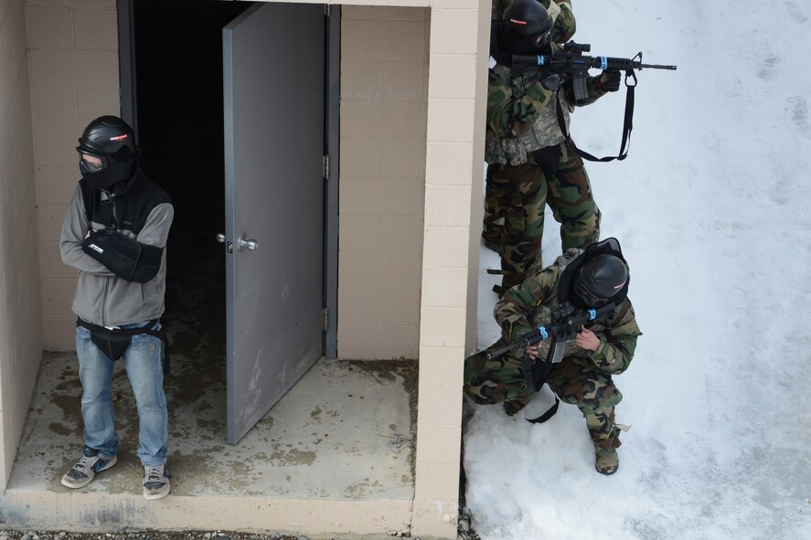 JOINT BASE ELMENDORF-RICHARDSON, Alaska -- 176 and 477th Security Forces Squadron members train together here April 11, 2014, during the Polar Guard 14-1 exercise. U.S. Air Force photo by Tech. Sgt Dana Rosso/ Released