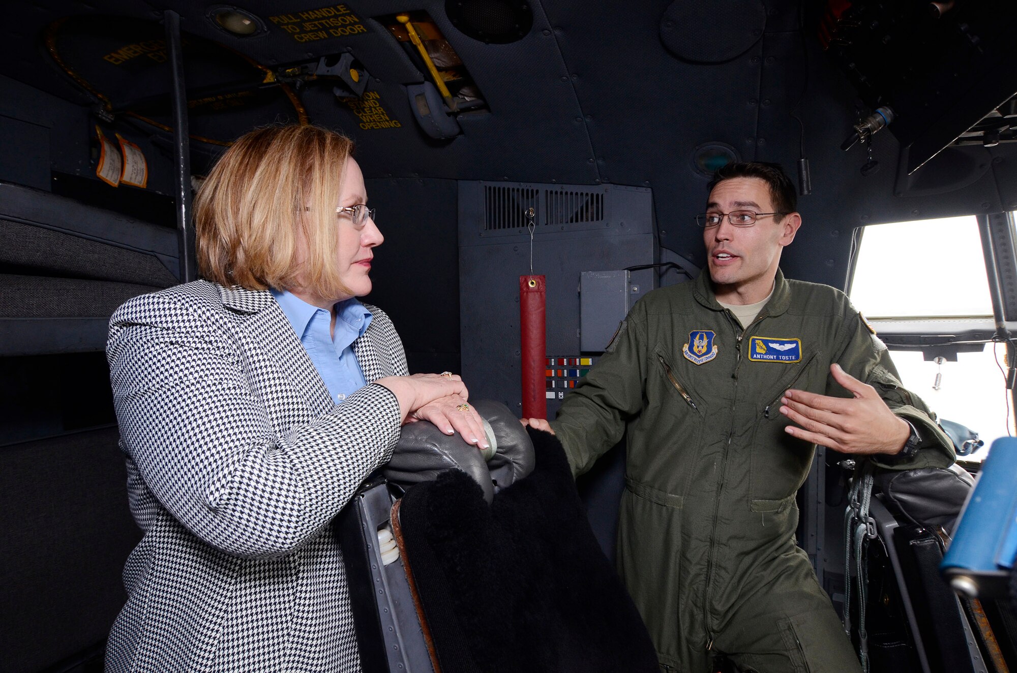 Mary Estes, director from Saint Leo University Marietta Center, visits with 1st Lt. Anthony Toste, 700th Airlift Squadron, C-130 Hercules pilot during a tour of Dobbins Air Reserve Base, Ga., May 19, 2014. University Staff members spoke with personnel from the 94th Security Forces Squadron, 94th OG, Explosive Ordnance Disposal members, and the 700AS, learning about organizational missions. (U.S. Air Force photo/Don Peek)