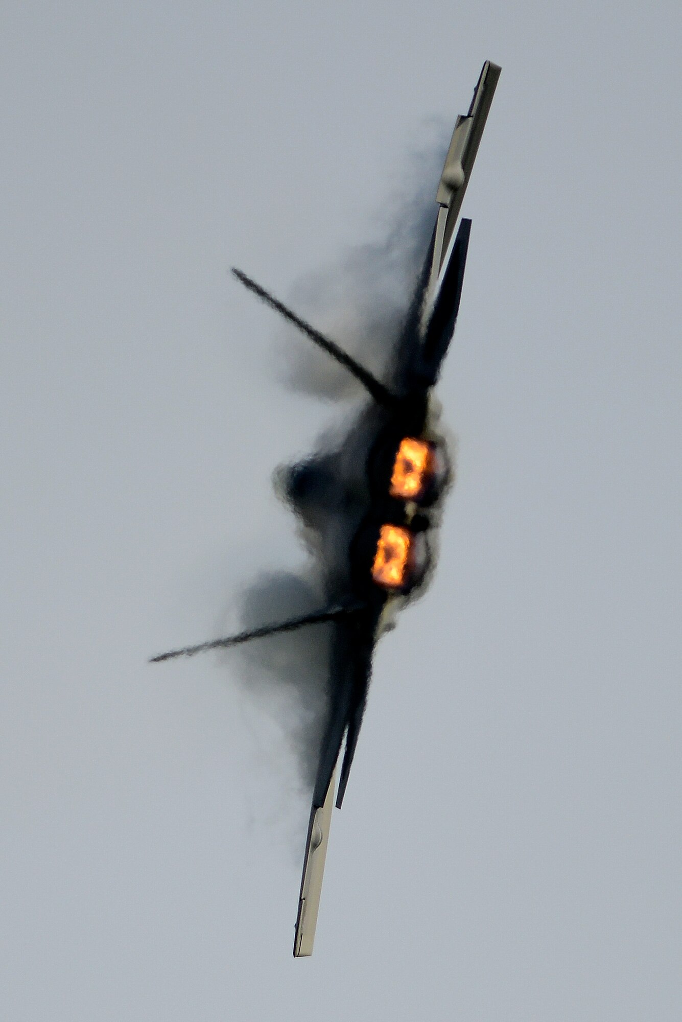 U.S. Air Force Capt. John “Taboo” Cummings, 1st Fighter Wing F-22 Raptor pilot, executes a maneuver during a solo demonstration at Langley Air Force Base, Va., May 21, 2014. Local media outlets were invited to watch as the F-22 Demonstration Team prepares for the Virginia Beach Oceanfront Air Show and Patriotic Festival, May 30 through June 1.  (U.S. Air Force photo by Senior Airman Kayla Newman/Released) 