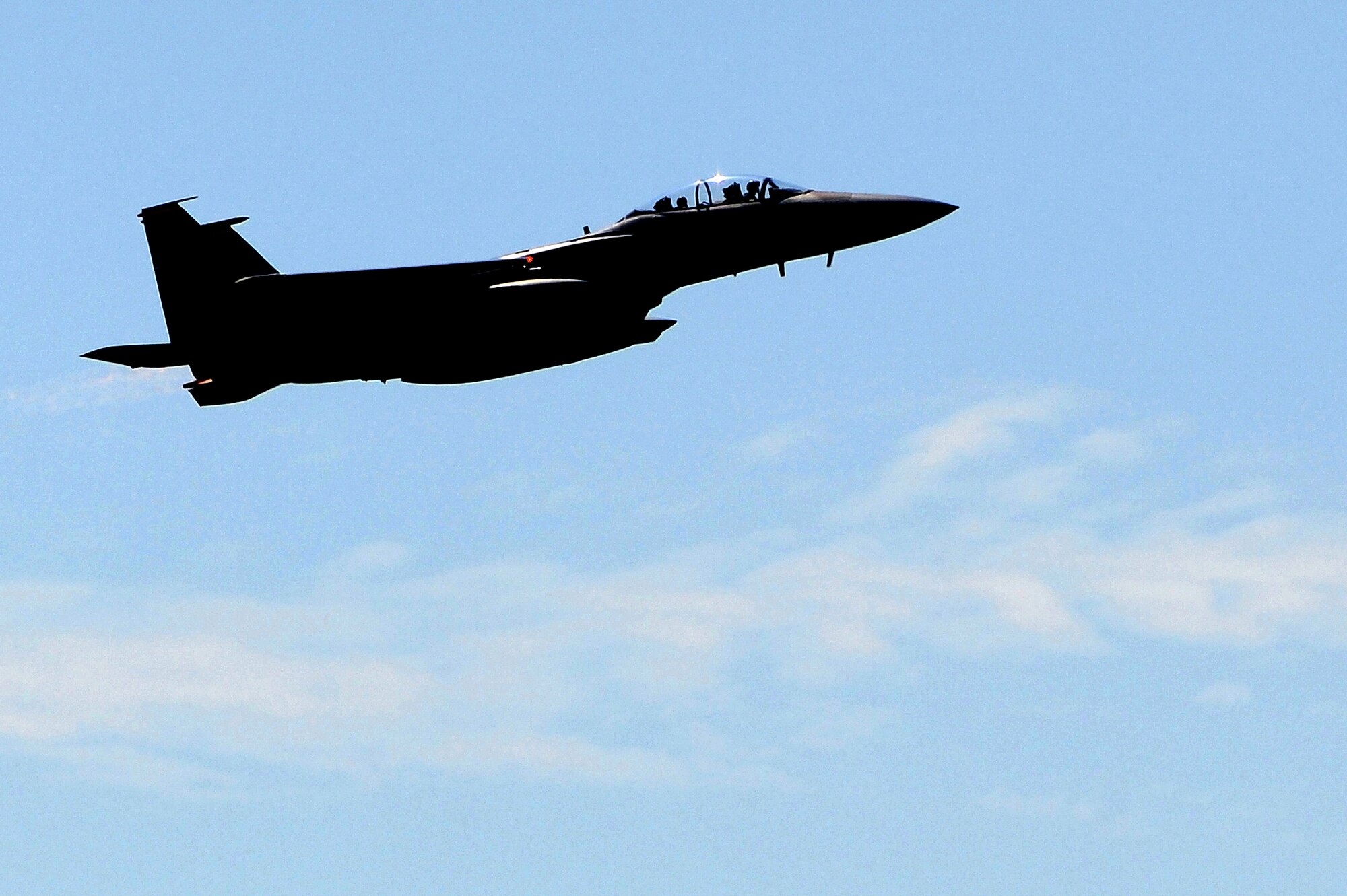 An F-15E Strike Eagle aircraft flies through the sky during Employment Exercise CORONET WARRIOR 14-02, May 20, 2014, at Seymour Johnson Air Force Base, North Carolina. The exercise tested and prepared Airmen to support overseas contingency operations and effectively complete the mission of the 4th Fighter Wing: to provide Strike Eagle airpower, anytime, anyplace. (U.S. Air Force photo/Senior Airman John Nieves Camacho)