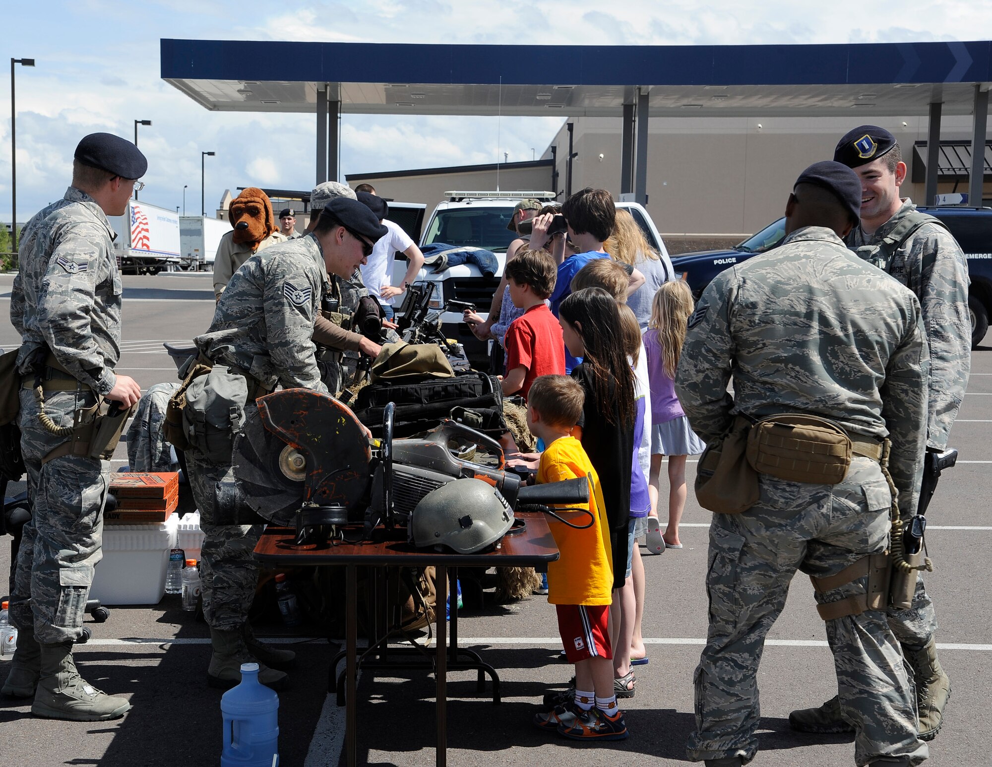 Team Malmstrom members host an open house at Malmstrom Air Force Base’s Exchange in honor of National Police Week on May 17. During the event, security forces members along with Airmen from the 341st  Security Forces Group Tactical Response Force had the opportunity to show people some of the tools they use on a daily basis to accomplish their mission. (U.S. Air Force photo/Airman 1st Class Collin Schmidt) 