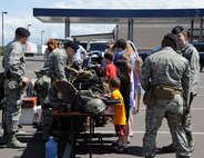 Team Malmstrom members host an open house at Malmstrom Air Force Base’s Exchange in honor of National Police Week on May 17. During the event, security forces members along with Airmen from the 341st  Security Forces Group Tactical Response Force had the opportunity to show people some of the tools they use on a daily basis to accomplish their mission. (U.S. Air Force photo/Airman 1st Class Collin Schmidt) 