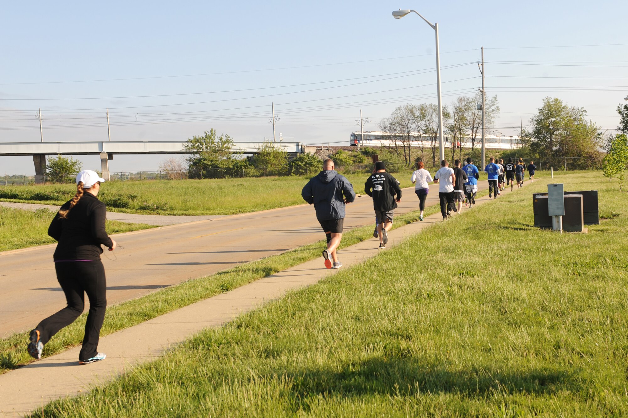 Runners begin their 3-mile run during the 1st Annual Team Scott Port Dawg Memorial 5K at Scott Air Force Base, Ill., May 12, 2014.  The run was to remember 16 fallen port dawgs.  To commemorate National Transportation Week, the base is hosting a number of events from May 12-16, including transportation demonstrations of the vehicles from the static display and a 5K walk/run to honor fallen transportation personnel.  (U.S. Air Force photo by Staff Sgt. Maria Bowman)