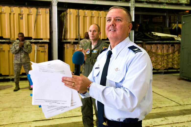 Col. Robert A. Meyer Jr., 108th Wing Commander, announces the Air Mobility Command Inspector General team's inspection results to members of the 108th Wing, New Jersey Air National Guard, May 21, 2014 at Joint Base McGuire-Dix-Lakehurst, N.J. The Wing underwent a Unit Effectiveness Inspection, which began on May 14 and ended May 18. Highly effective is the second highest grade a unit can receive in a UEI and it is the highest grade that has been given to date in this new inspection system. The UEI is part of the new Air Force Inspection System, which places a priority on continuous unit readiness verified by self-inspection and wing-based inspections. (U.S. Air National Guard photo by Master Sgt. Mark C. Olsen/Released) (This image was cropped to focus on the subject of the image)