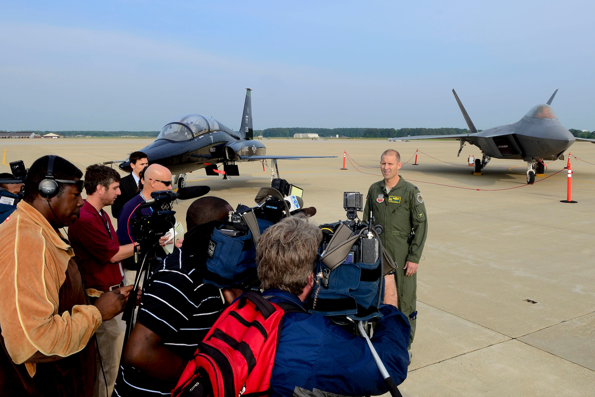 U.S. Air Force Col. Kevin Huyck, 1st Fighter Wing commander, shares the 1FW mission with local media during a 1FW Media Day at Langley Air Force Base, Virginia, May 21, 2014. The F-22’s combination of stealth, supercruise, maneuverability and integrated avionics, coupled with improved supportability, represents an exponential leap in warfighting capabilities. (U.S. Air Force photo by Staff Sgt. Antoinette Gibson/Released)