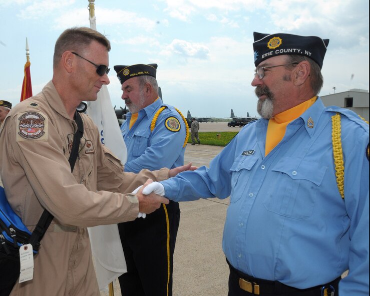 Lieutenant Colonel George Hoffman, 328th Airlift Squadron, chief of Standardized Evaluation thanks a member of the American Legion Post 362 Aurora, New York Color Guard for coming out to honor the troops at the Niagara Falls Air Reserve Station, N.Y. May 19, 2014. More than 100 members were deployed overseas recently and have now returned home. (U.S. Air Force photo by Peter Borys)