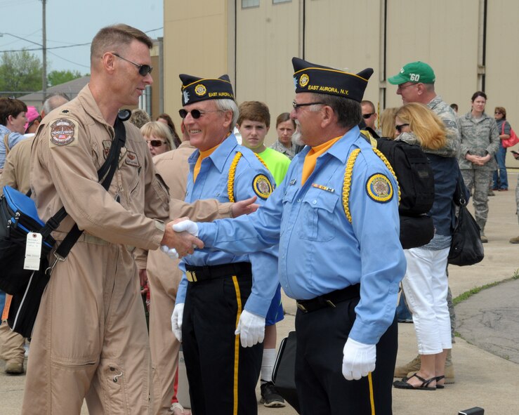 Lieutenant Colonel George Hoffman, 328th Airlift Squadron, chief of Standardized Evaluation thanks a member of the American Legion Post 362 Aurora, New York Color Guard for coming out to honor the troops at the Niagara Falls Air Reserve Station, N.Y. May 19, 2014. More than 100 members were deployed overseas recently and have now returned home. (U.S. Air Force photo by Peter Borys)