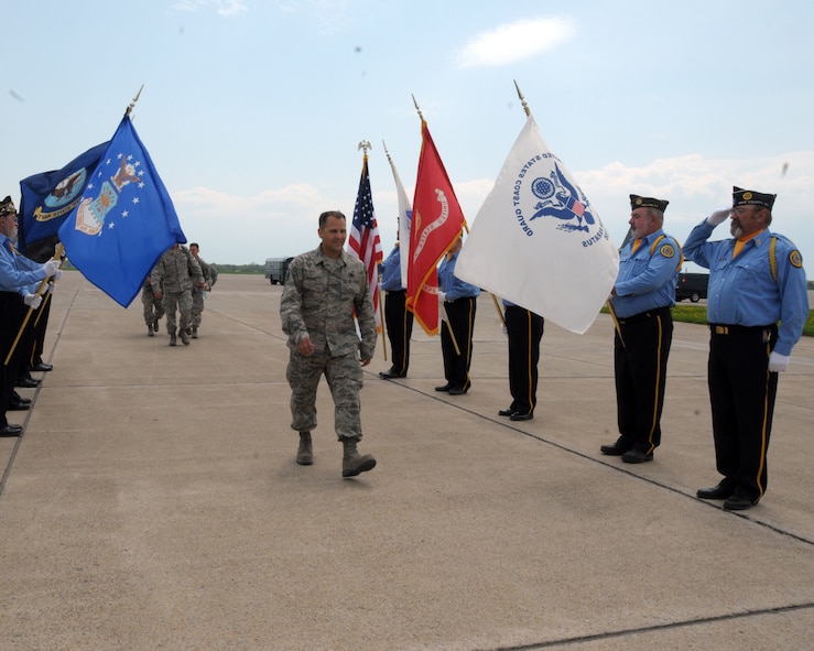 American Legion Post 362 Color Guard, East Aurora, New York stand at attention as 914th Airlift Wing members return to Niagara Falls Air Reserve Station, N.Y. May 19, 2014. More than 100 members were deployed overseas recently and have now returned home. (U.S. Air Force photo by Peter Borys)