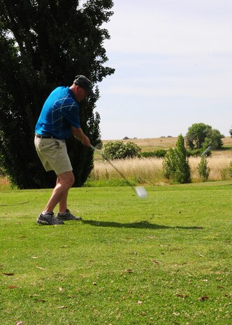 Col. Quinn Gummel, 9th Reconnaissance Wing vice commander, tees off during the Beale Military Liaison Committee golf tournament at the Coyote Run Golf Course on Beale Air Force Base, Calif., May 16, 2014. The four-person, best-ball tournament strengthened ties between the base and local community leaders and provided an opportunity for new honorary commanders to build rapport with their military counterparts. (U.S. Air Force photo by Senior Airman Allen Pollard/Released)
