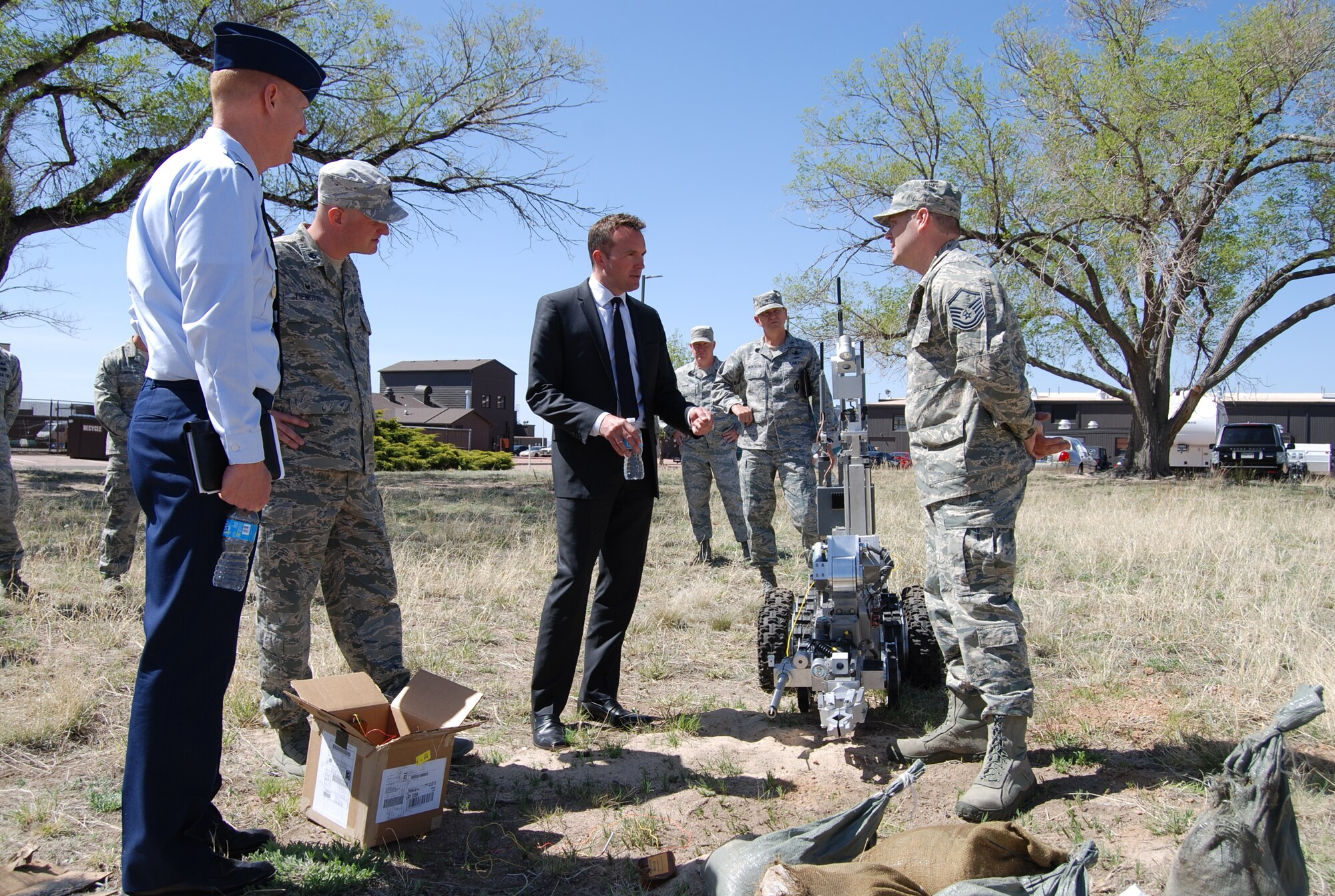 PETERSON AIR FORCE BASE, Colo. – Undersecretary of the Air Force Eric Fanning inspects the results of disarming a mock improvised explosive device at the 21st Civil Engineer Squadron Explosive Ordnance Disposal flight during his visit here May 19. While here Fanning visited various facilities including the Area Dental Laboratory and military working dog section to gain insight into the day-to-day lives of Airmen. (U.S. Air Force photo/Michael Golembesky)