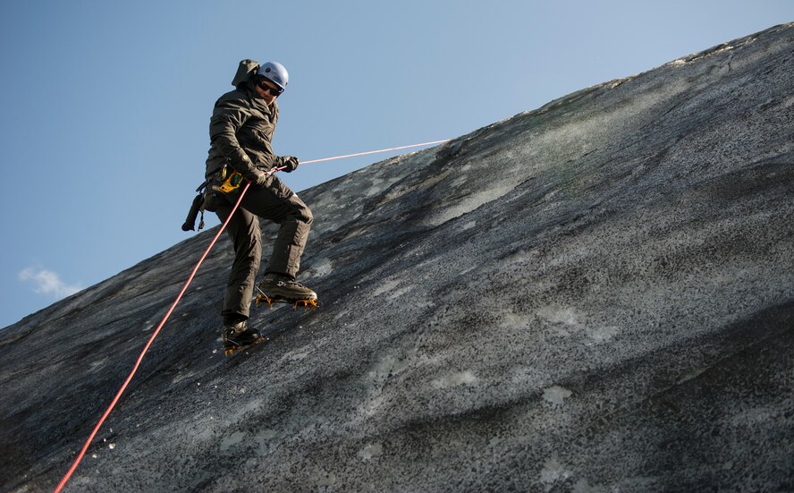 Senior Airman Dylan, 48th Air Expeditionary Group pararescueman, rappels down the side of a glacier during training near Keflavik, Iceland, May 18, 2014. Although the Airmen’s primary objective is to rescue downed aircrew deployed with the 48th Air Expeditionary Group for Icelandic Air Policing if needed, the trip provides an opportunity to accomplish training objectives the team wouldn’t ordinarily have access to near Kadena Air Base, Japan, from where they are deployed. (U.S. Air Force photo/Tech. Sgt. Benjamin Wilson)