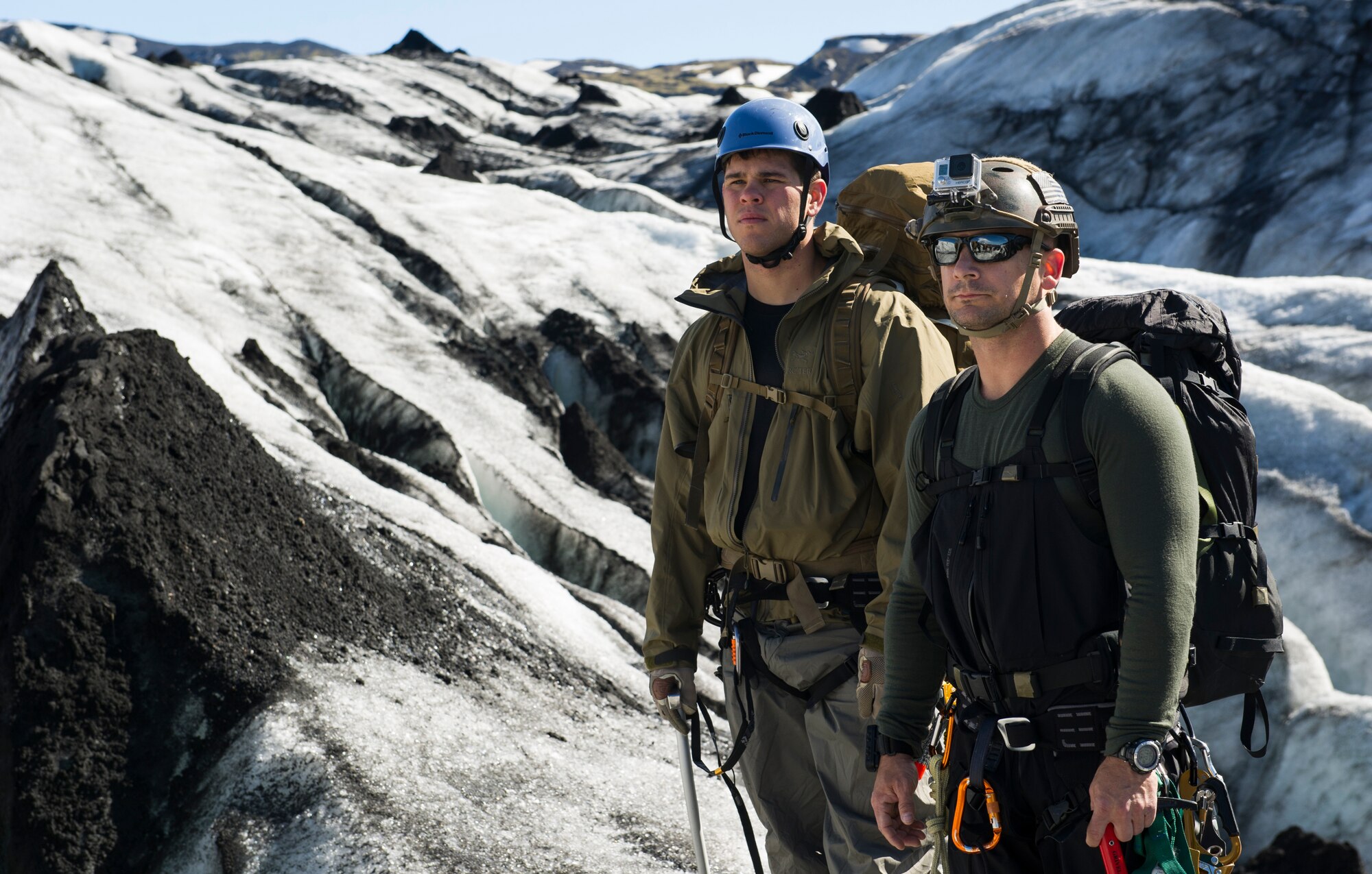 KEFLAVIK, Iceland -- Capt. Paul (left), 48th Air Expeditionary Group combat rescue officer, and Senior Master Sgt. Caleb, 48th AEG pararescueman, look out over a glacier during training near Keflavik, Iceland, May 18, 2014. The Airmen are deployed for Icelandic Air Policing to rescue downed aircrew deployed with the 48th Air Expeditionary Group if needed, but the trip provides an opportunity to accomplish training objectives the team wouldn’t ordinarily have access to near Kadena Air Base, Japan, from where they are deployed. (U.S. Air Force photo/Tech. Sgt. Benjamin Wilson) (Released)