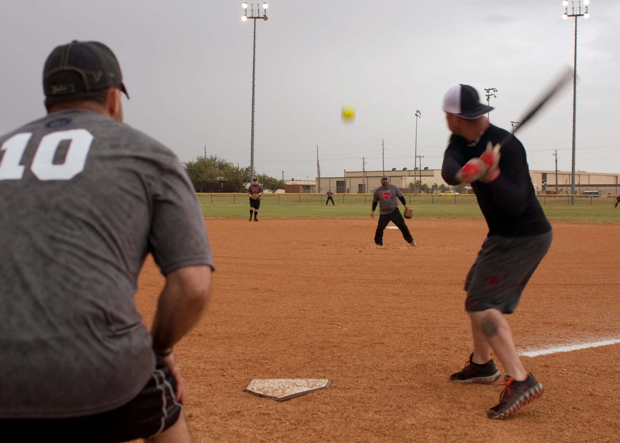 U.S. Air Force Staff Sgt. Will Davis, 7th Security Forces Squadron, swings at a pitch May 13, 2014, at Dyess Air Force Base, Texas. The Abilene Police Department played against the 7th SFS in honor of all fallen law enforcement members and fellow Airmen who have given their lives in the line of duty. The 7th SFS and APD participated in several events in honor of National Police Week. (U.S. Air Force photo by Senior Airman Peter Thompson/Released)