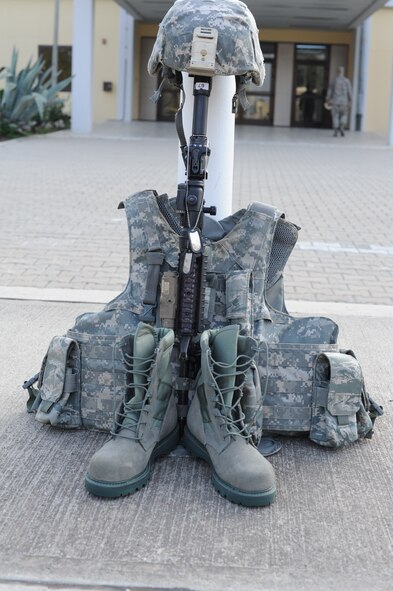A display in remberance of fallen policemen sits outside 39th Air Base Wing headquaters during a police week vigil May 16, 2014, Incirlik Air Base, Turkey. The vigil was the kick-off ceremony for the police week events on Incirlik. (U.S. Air Force photo by Staff Sgt. Eboni Reams/Released)