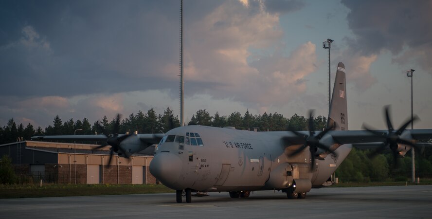 U.S. Air Force Maj. Jeff Bliss, a Grand Rapids, Michigan native and Capt. Brett Polage, a Mount Vernon, Indiana native, 37th Airlift Squadron pilots, take off in a C-130J Super Hercules over an Estonian runway filled with American and Estonian paratroopers, May 19, 2014. Pilots and loadmasters from the 37th AS alongside an 86th Aircraft Maintenance Squadron crew chief spent four days across three Baltic countries assisting in personnel drops of allied partners and American service members. (U.S. Air Force photo/Airman 1st Class Jordan Castelan)