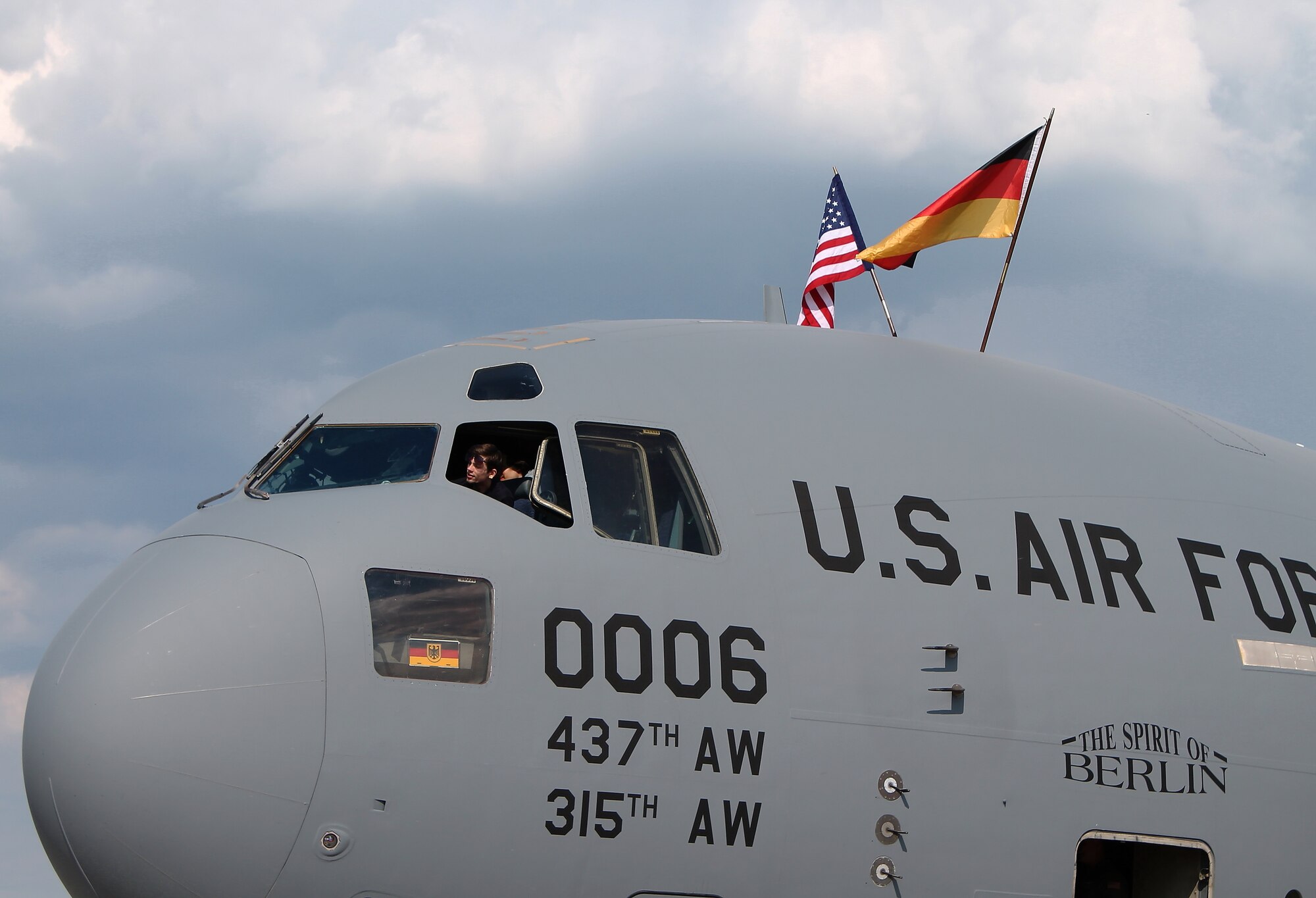 A spectator at this year’s Berlin Trade and Air Show sits in the cockpit of the C-17 Globemaster III “Spirit of Berlin”, Berlin, May 20, 2014.  The Spirit of Berlin was dedicated by former U.S. President Bill Clinton in 1998 on the 50th anniversary of the Berlin Airlift.  The aircrew members of the aircraft are stationed at Joint Base Charleston, S.C. and make the bi-annual trek to take part in the U.S. presence at the international show. (U.S. Air Force photo/ 2nd Lt. Clay Lancaster)