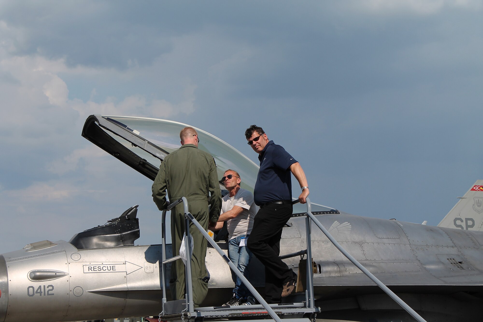 U.S. Air Force Capt. Casey “Deuce” Manning, F-16 Fighting Falcon pilot from Spangdahlem Air Base, Germany, discusses aircraft capabilities with spectators at this year’s Berlin Trade and Air Show, Berlin, May 20, 2014.  More than 60 U.S. service members and their aircraft made their way from several bases within USAFE-AFAFRICA and Army commands to take part in the week-long air show, which is an international event with over 100 participating nations. (U.S. Air Force photo/ 2nd Lt. Clay Lancaster)