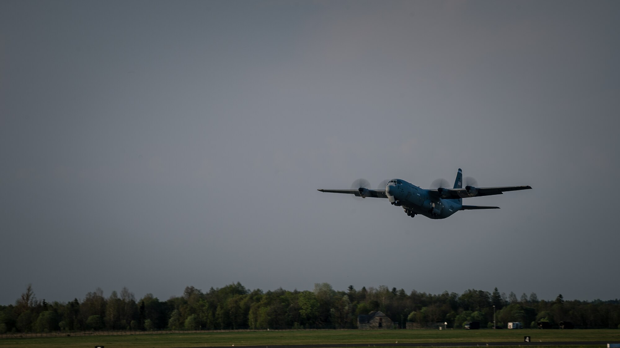 U.S. Air Force Maj. Jeff Bliss, a Grand Rapids, Michigan native and Capt. Brett Polage, a Mount Vernon, Indiana native, 37th Airlift Squadron pilots, take off in a C-130J Super Hercules over an Estonian runway filled with American and Estonian paratroopers, May 19, 2014. Pilots and loadmasters from the 37th AS alongside an 86th Aircraft Maintenance Squadron crew chief spent four days across three Baltic countries assisting in personnel drops of allied partners and American service members. (U.S. Air Force photo/Airman 1st Class Jordan Castelan)