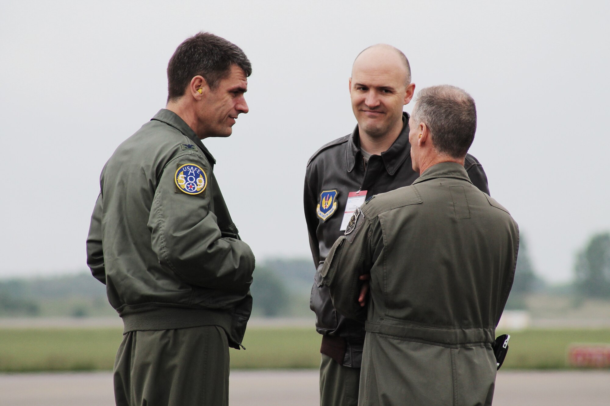 U.S. Air Force Col. Robert Webb, Lt. Col. Tom Morgan and Lt. Col. Kerry Evans discuss aircraft placement details at this year’s Berlin Trade and Air Show, Berlin, May 19, 2014.  The U.S. aircraft on the ramp were open for spectators and vendors within the aerospace industry to observe and interact with all crew members who not only operate the aircraft, but also maintain them. (U.S. Air Force photo/ 2nd Lt. Clay Lancaster)