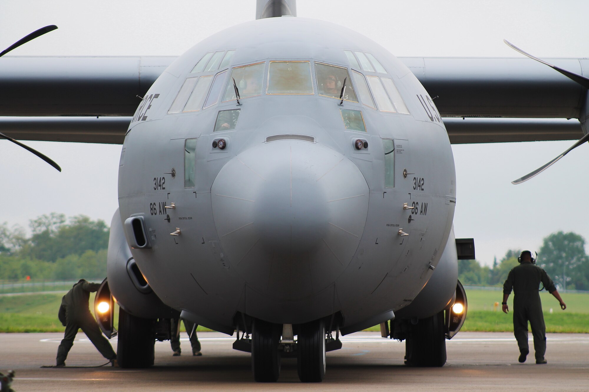 U.S. Air Force C-130J Super Hercules aircrew members perform post-flight ground procedures after arriving for the 2014 Berlin Trade and Air Show, Berlin, May 21, 2014.  The trade show, which is held every two years, represents a unique opportunity for U.S. and military allies to showcase their leadership in aerospace technologies and to show spectators the type of equipment being used by the U.S. that is critical to the success of current and future military operations. (U.S. Air Force photo/ 2nd Lt. Clay Lancaster)